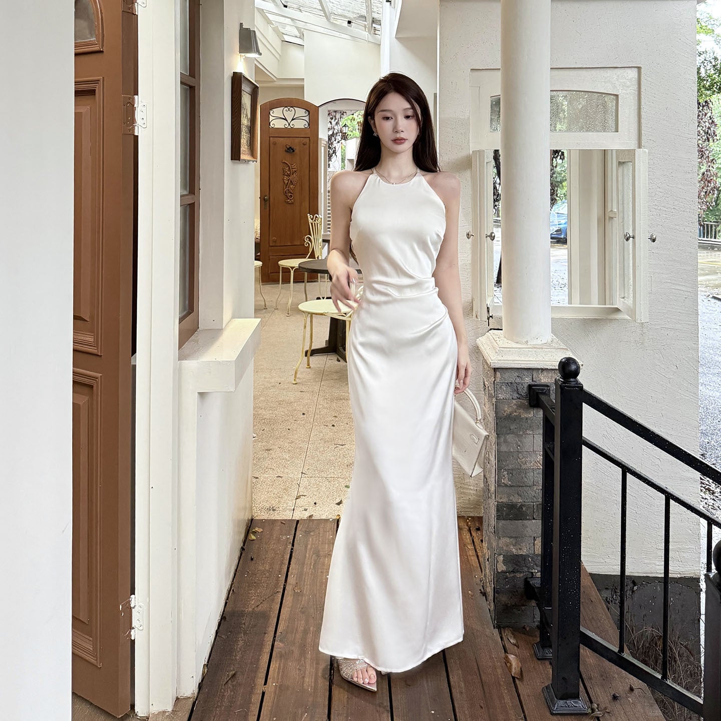 Sleeveless ruffled satin French-style dress with a high-end aesthetic