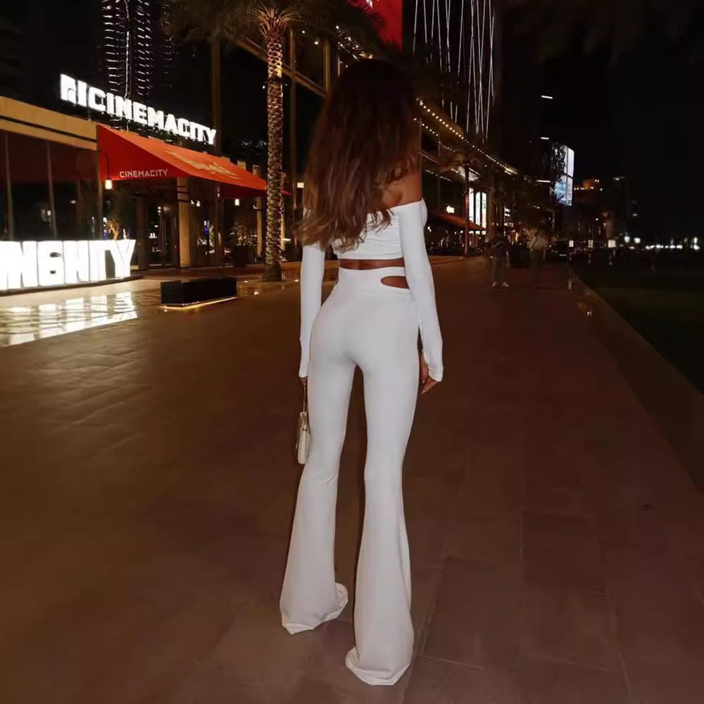 Hanging neck long sleeved top with hollowed out waist and micro flared long pants two-piece set