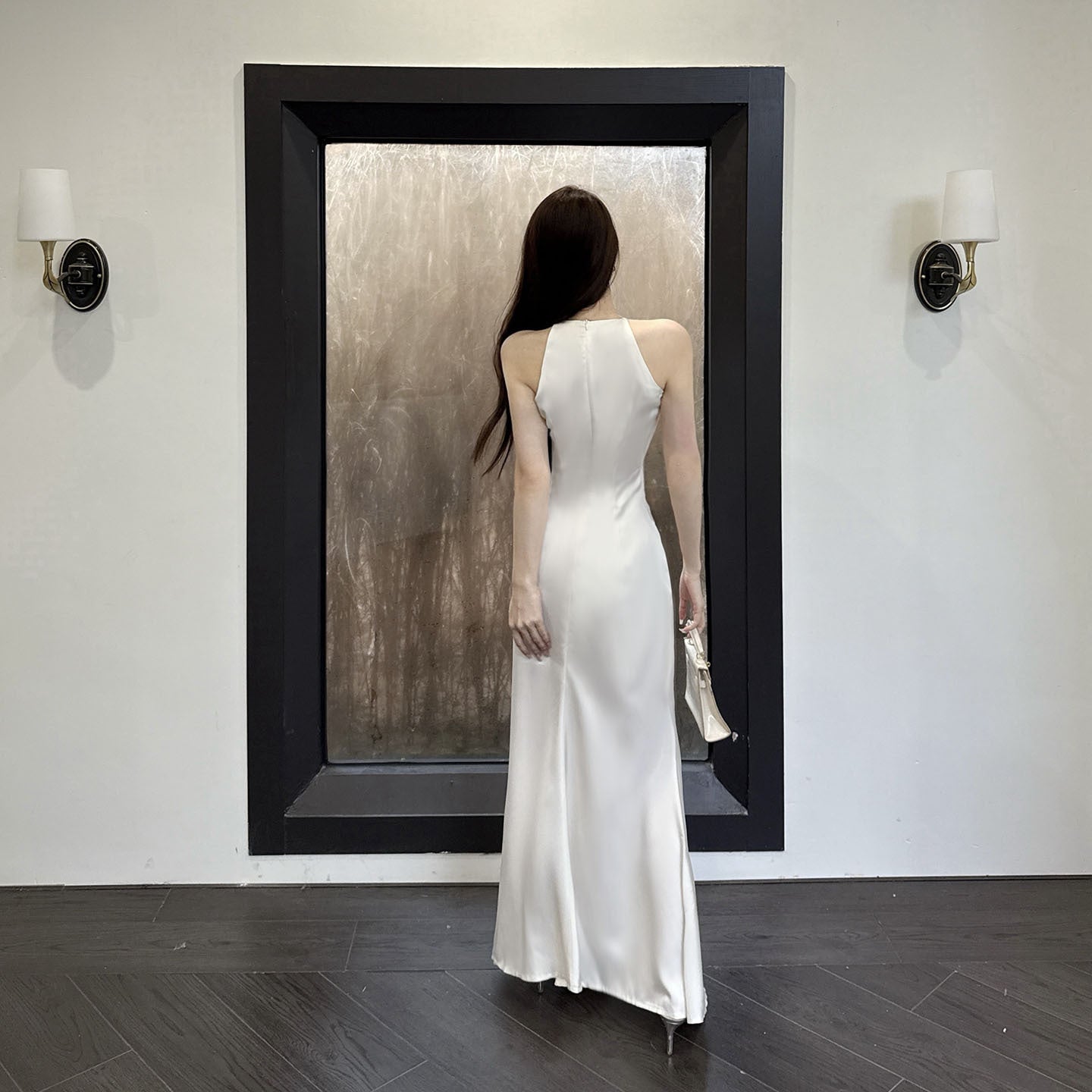 Sleeveless ruffled satin French-style dress with a high-end aesthetic